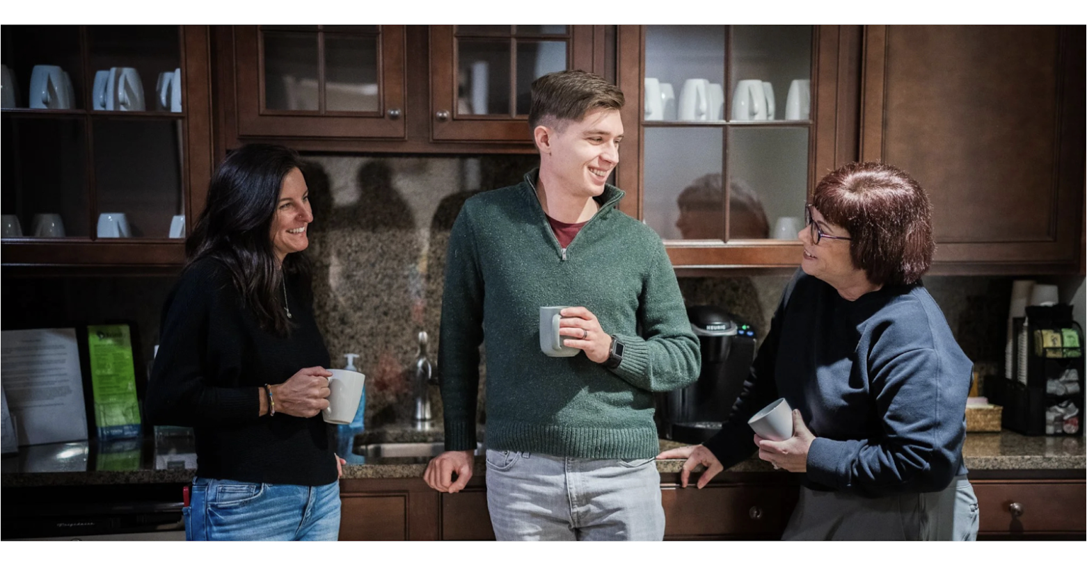 People chatting in a kitchen