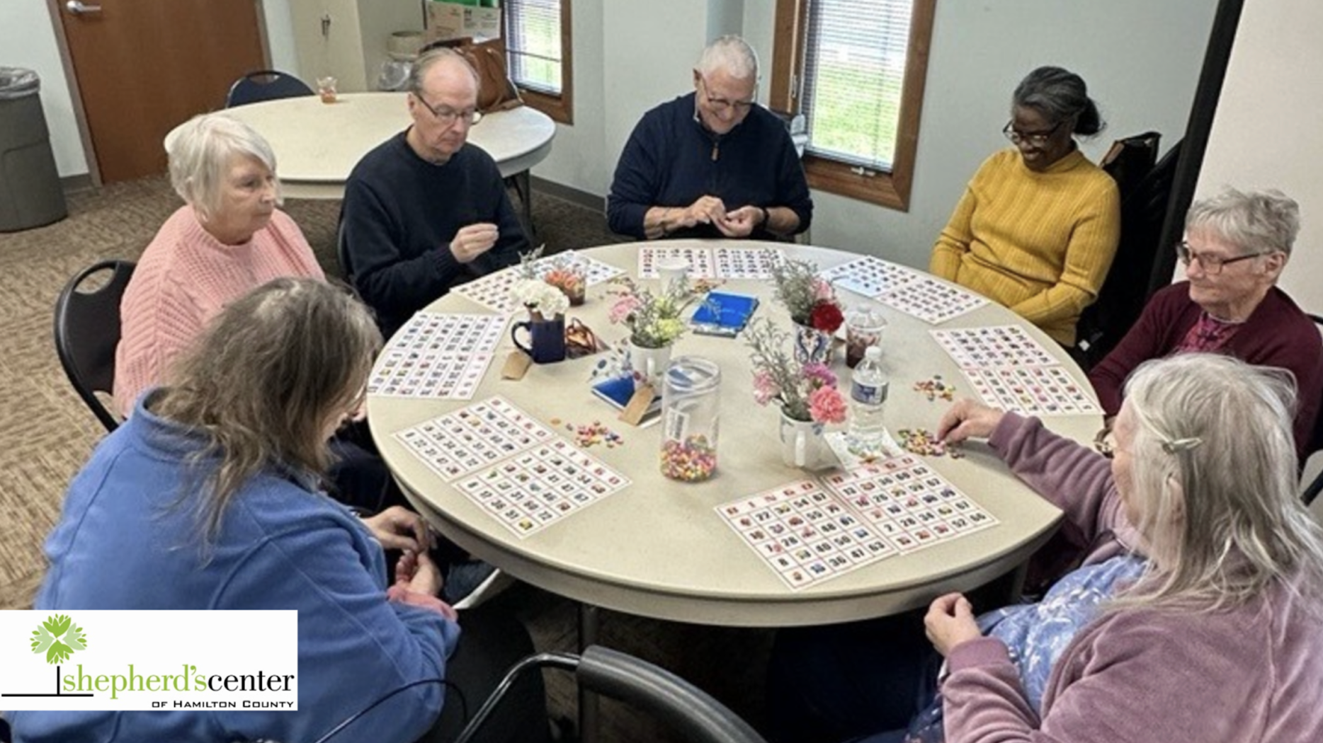 Residents playing bingo around a table